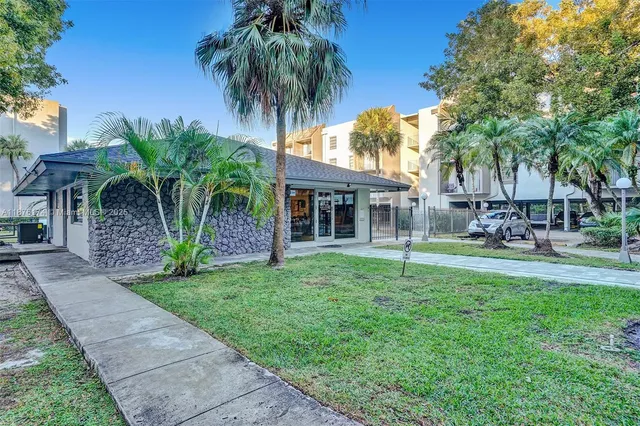 a house with a garden and trees