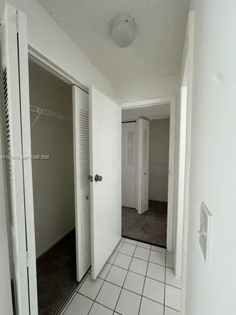 a bathroom with a tub sink toilet and a mirror