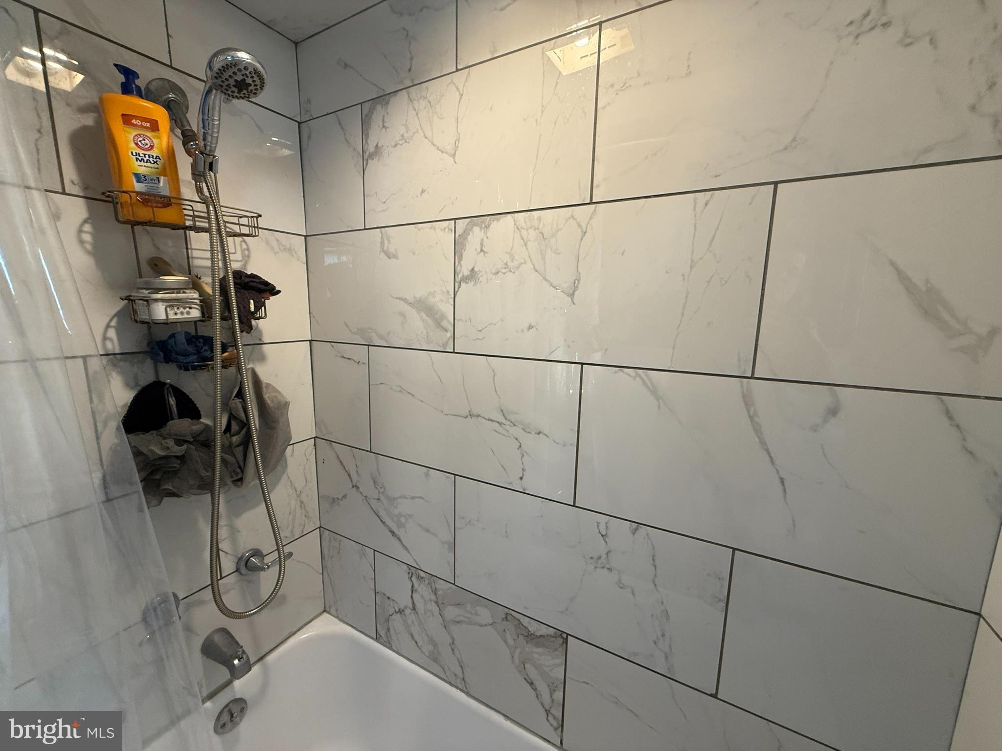 429 Pine Street Steelton, PA 17113 - Photo 11 of 25 a bathroom with a bathtub and a shower