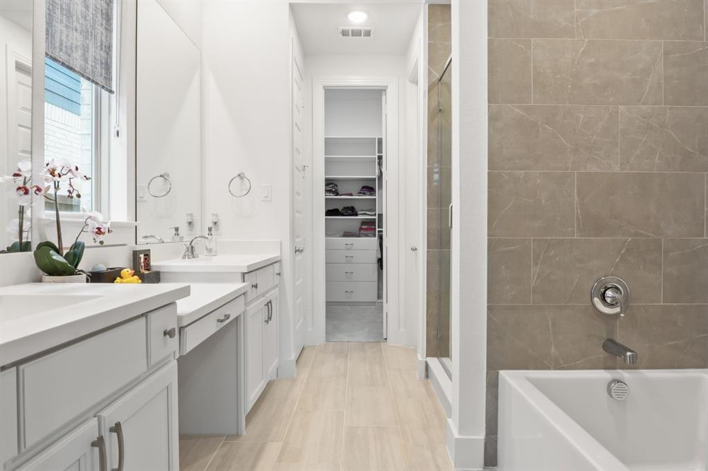 1255 Sumner Street Aubrey, TX 76227 - Photo 14 of 40 a spacious bathroom with a tub sink shower and mirror