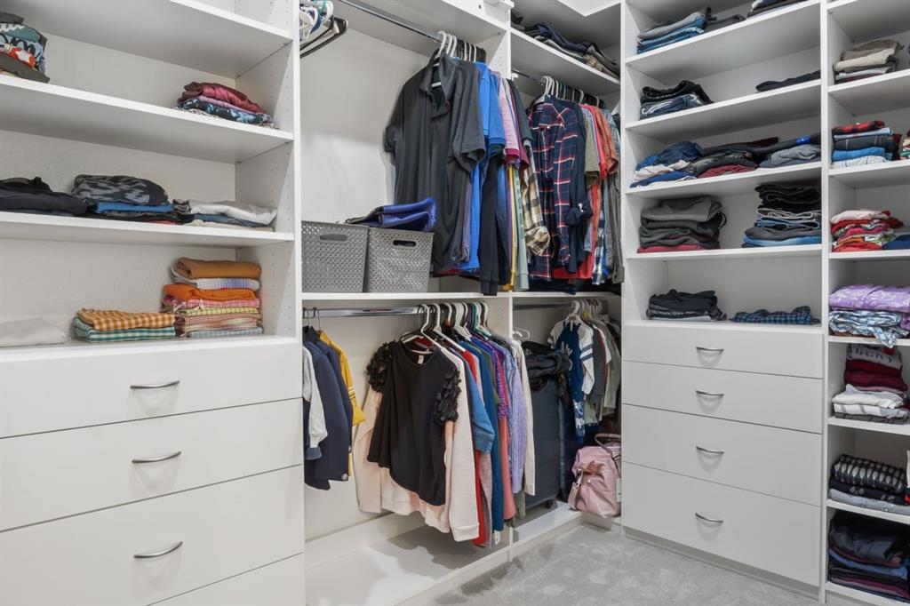 1255 Sumner Street Aubrey, TX 76227 - Photo 16 of 40 a view of walk in closet with clothes and shoes