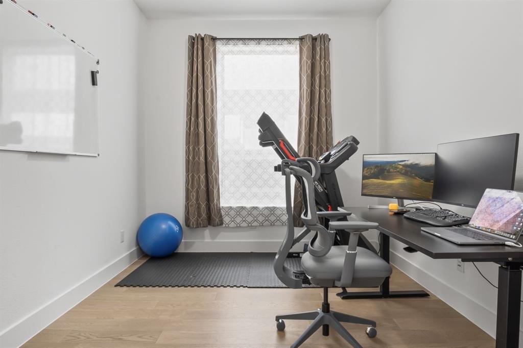 1255 Sumner Street Aubrey, TX 76227 - Photo 19 of 40 a view of workspace with wooden floor windows