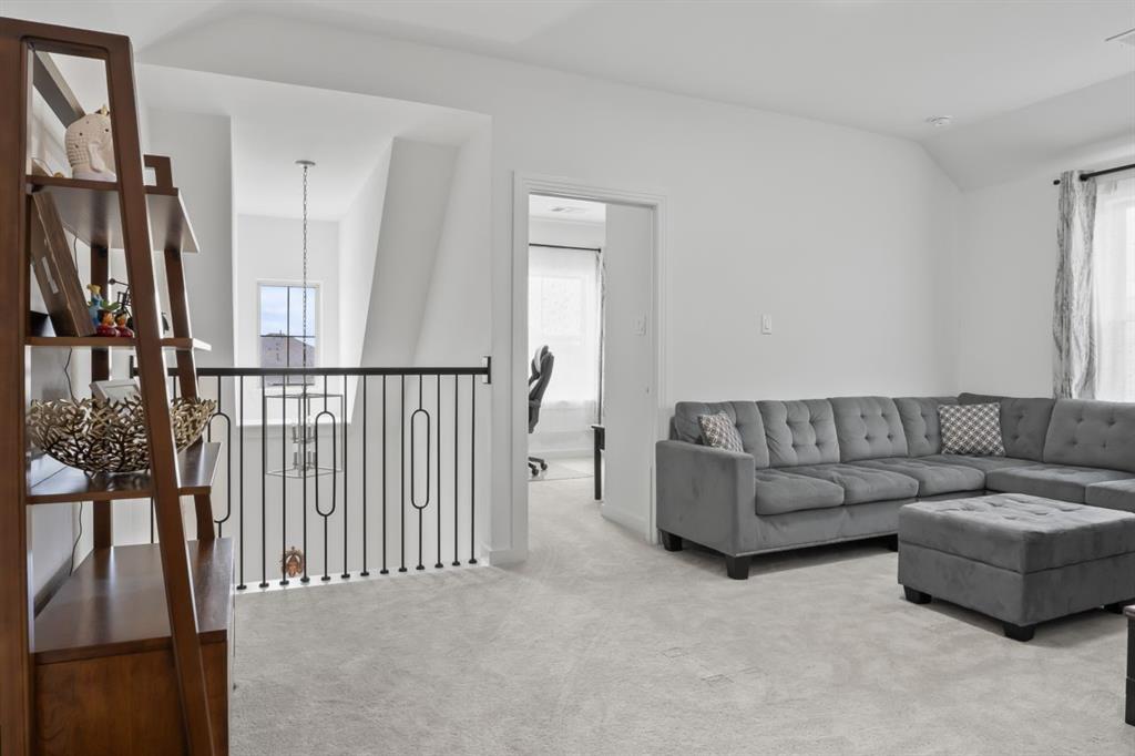 1255 Sumner Street Aubrey, TX 76227 - Photo 24 of 40 a living room with furniture and a window