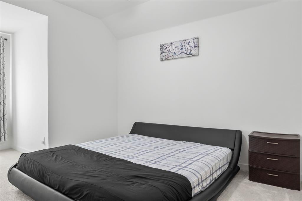 1255 Sumner Street Aubrey, TX 76227 - Photo 29 of 40 a bedroom with a bed and cabinets