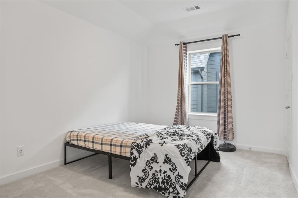 1255 Sumner Street Aubrey, TX 76227 - Photo 32 of 40 a bedroom with a bed and a window