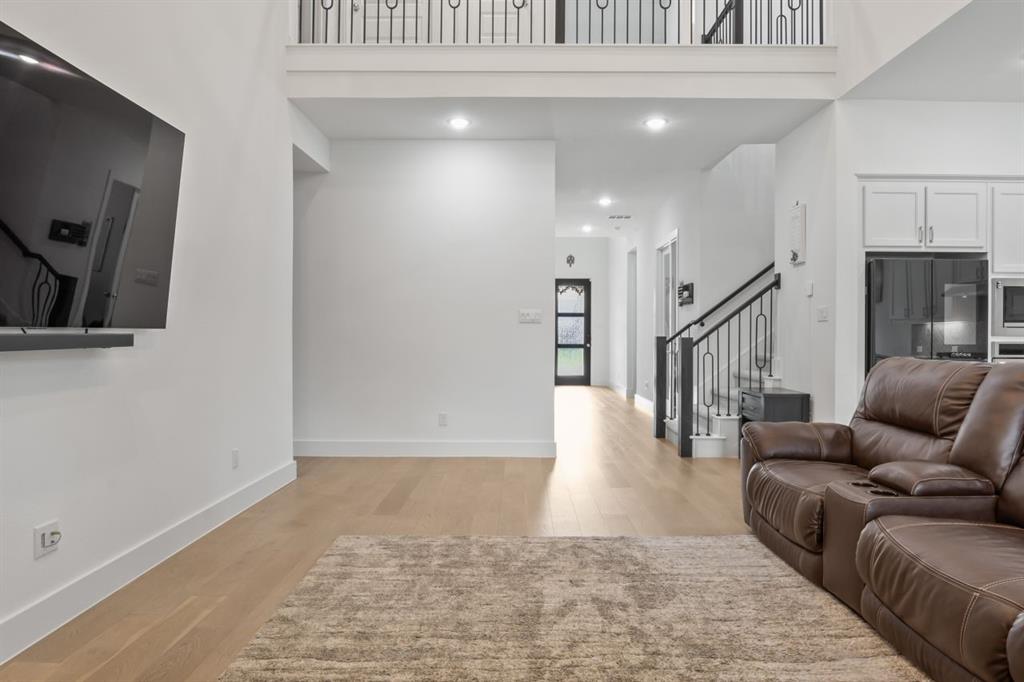 1255 Sumner Street Aubrey, TX 76227 - Photo 5 of 40 a living room with furniture and wooden floor