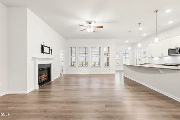 a view of kitchen with wooden floor and window