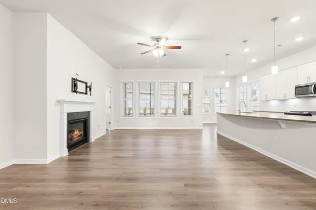 a view of kitchen with wooden floor and window