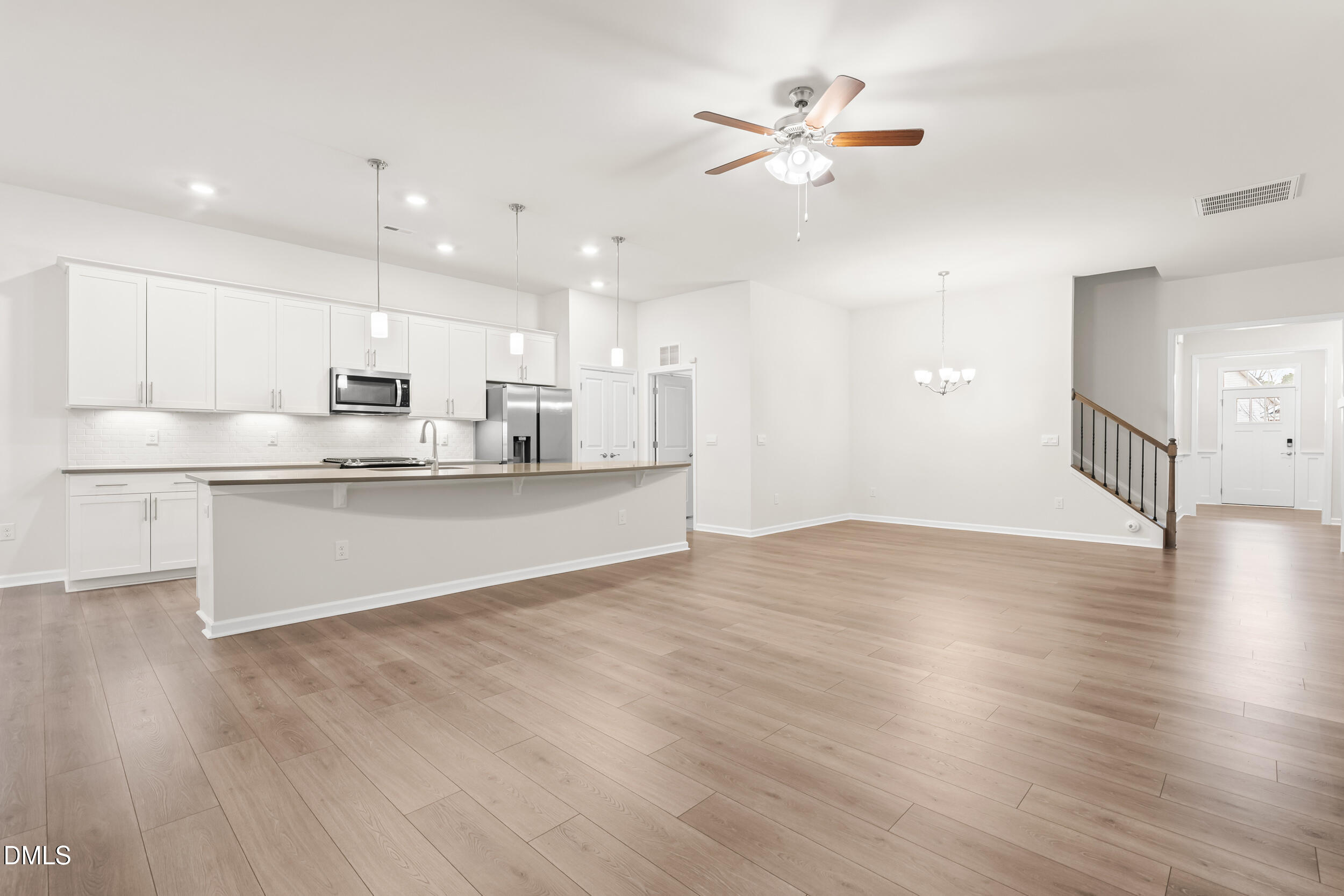 1 Bobby Parker Place Durham, NC 27703 - Photo 14 of 41 a view of kitchen with wooden floor and window