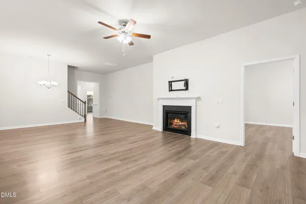 a large kitchen with kitchen island a large counter top stainless steel appliances and cabinets