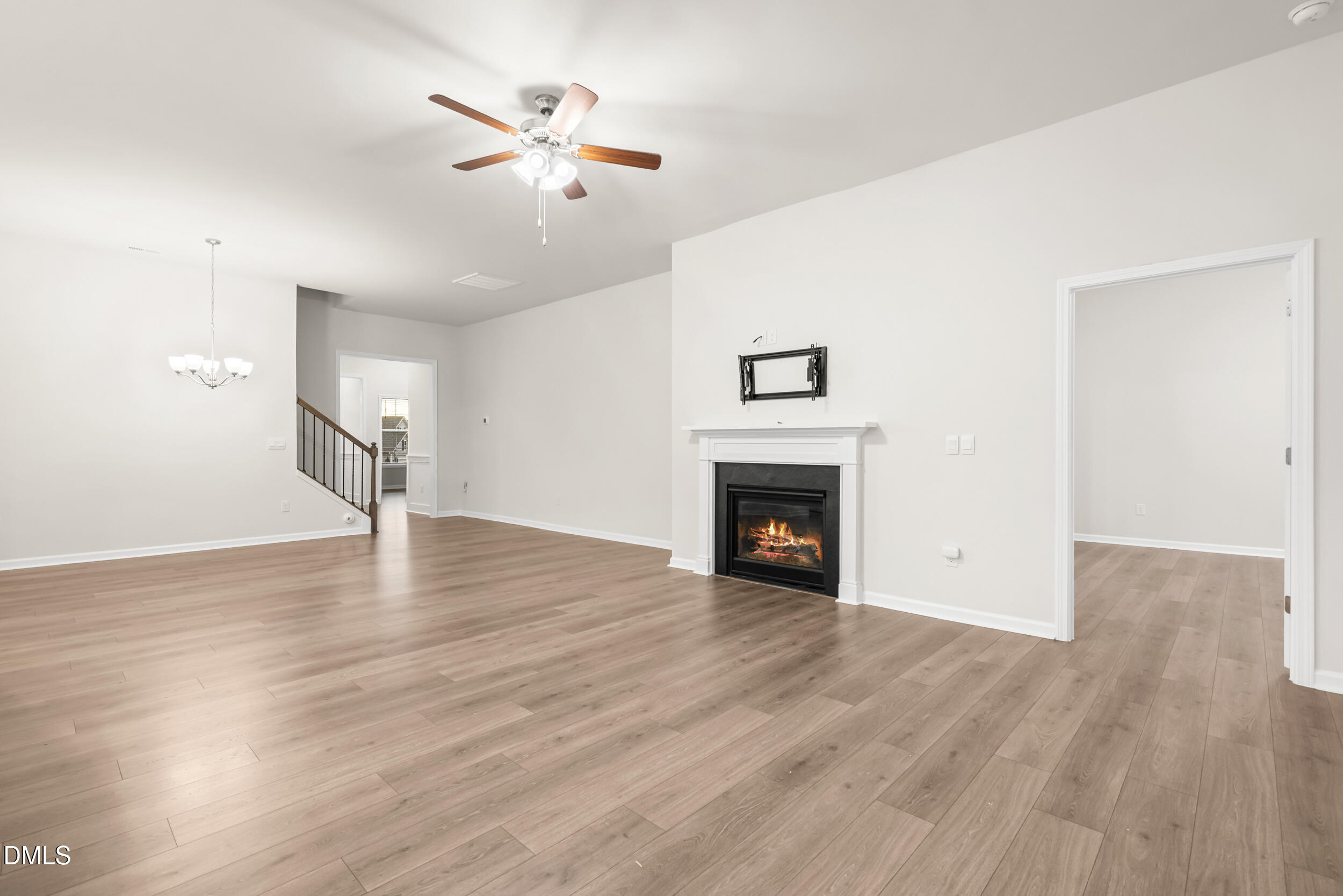 1 Bobby Parker Place Durham, NC 27703 - Photo 15 of 41 an empty room with wooden floor fan and windows