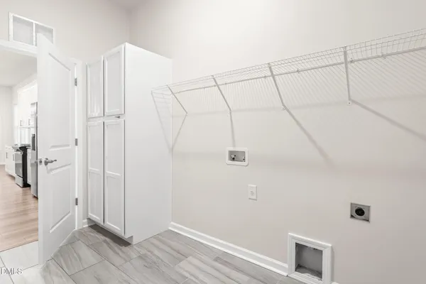 a view of a kitchen with kitchen island a sink a counter top space and stainless steel appliances