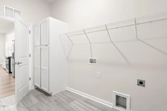 a view of a kitchen with kitchen island a sink a counter top space and stainless steel appliances
