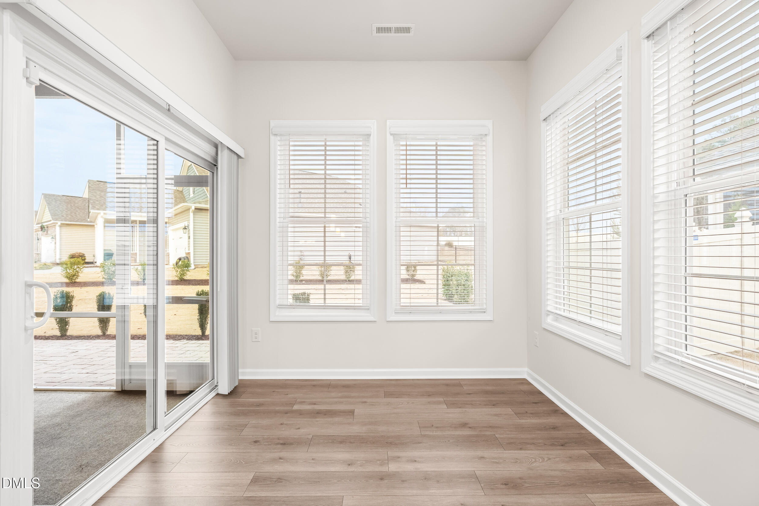 1 Bobby Parker Place Durham, NC 27703 - Photo 24 of 41 a view of an empty room with wooden floor and a window