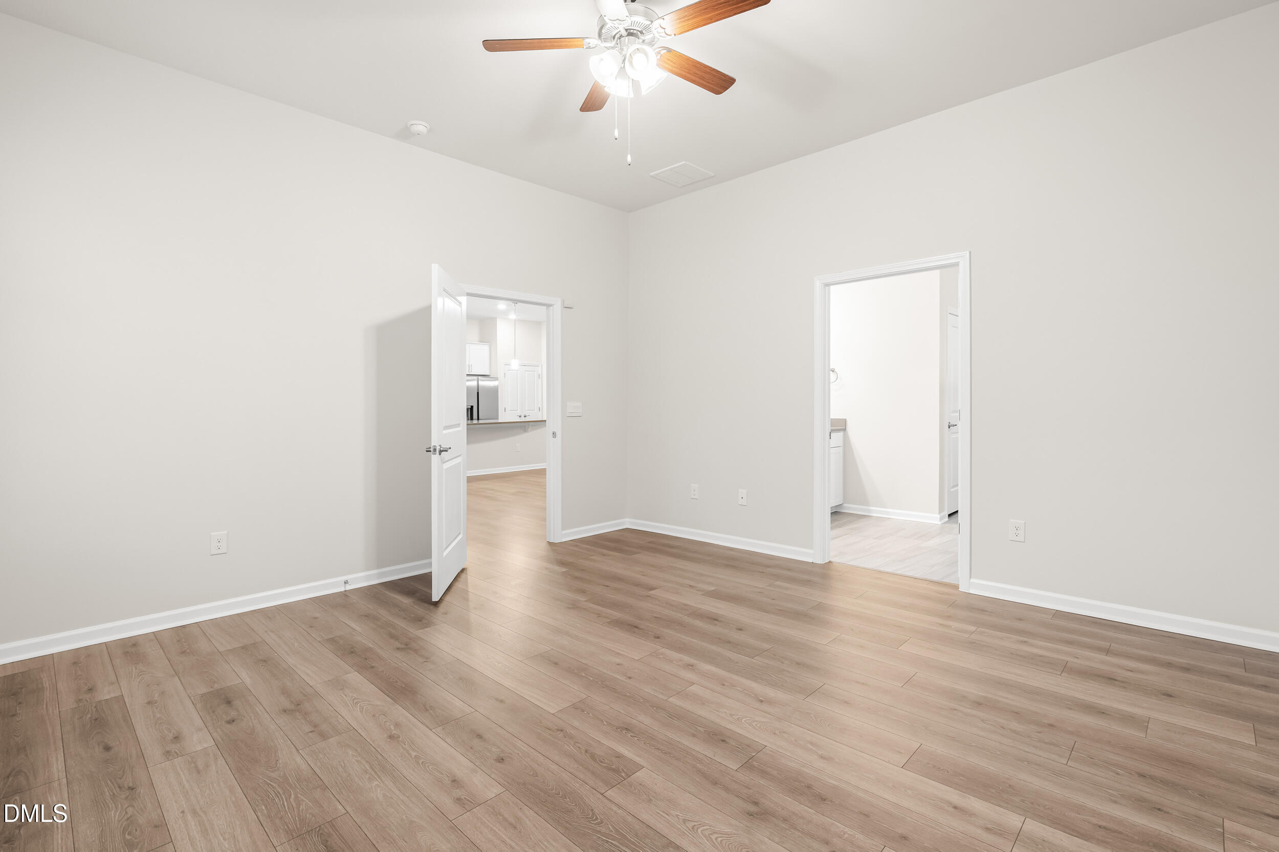 1 Bobby Parker Place Durham, NC 27703 - Photo 27 of 41 an empty room with wooden floor fan and windows