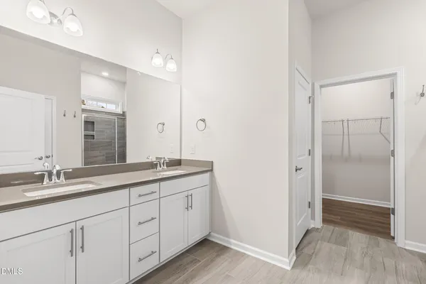 a bathroom with a granite countertop sink a toilet and a bathtub