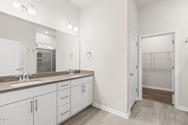 a bathroom with a granite countertop sink a toilet and a bathtub