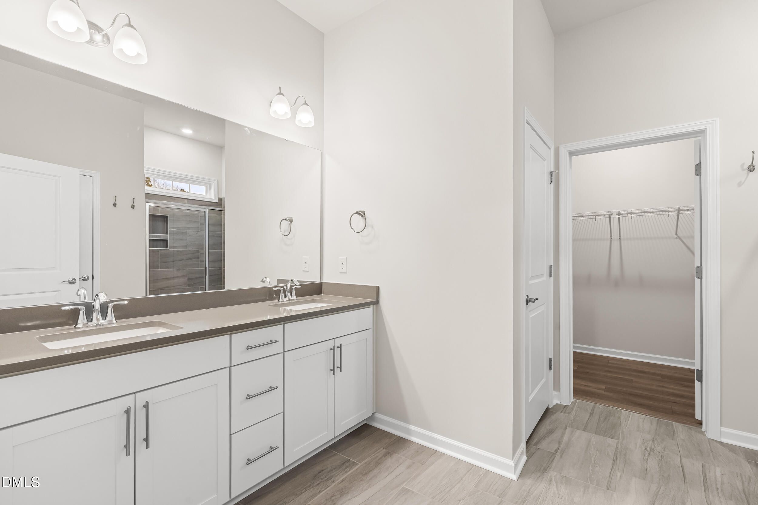 1 Bobby Parker Place Durham, NC 27703 - Photo 28 of 41 a bathroom with a double vanity sink and mirror
