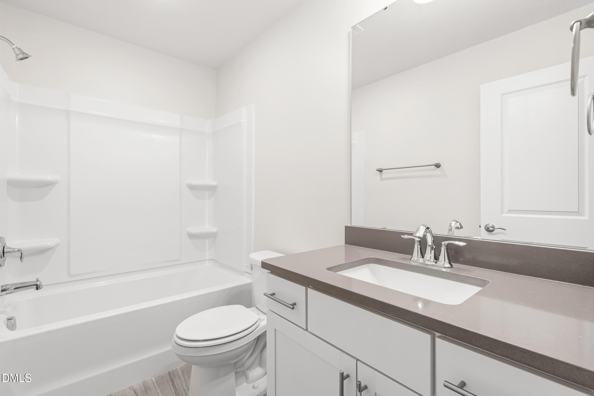 1 Bobby Parker Place Durham, NC 27703 - Photo 33 of 41 a bathroom with a granite countertop sink a toilet and a bathtub