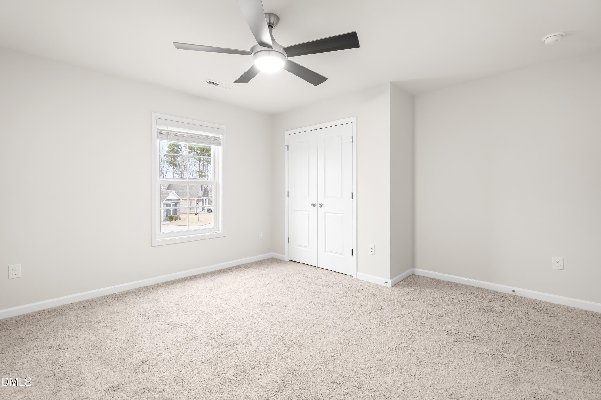1 Bobby Parker Place Durham, NC 27703 - Photo 34 of 41 an empty room with a window and a fan