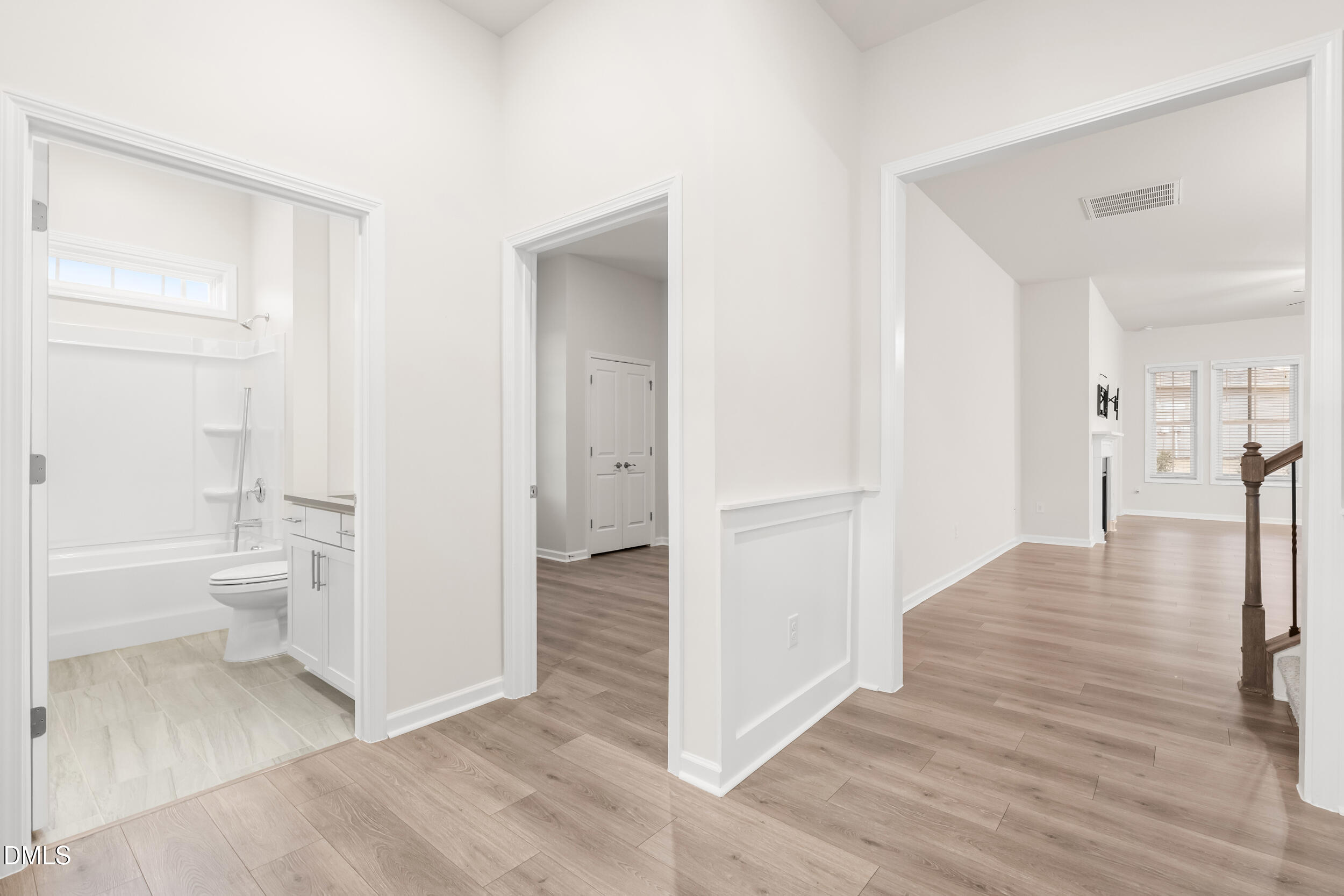 1 Bobby Parker Place Durham, NC 27703 - Photo 5 of 41 a view of a bathroom with a walk in closet and wooden floor
