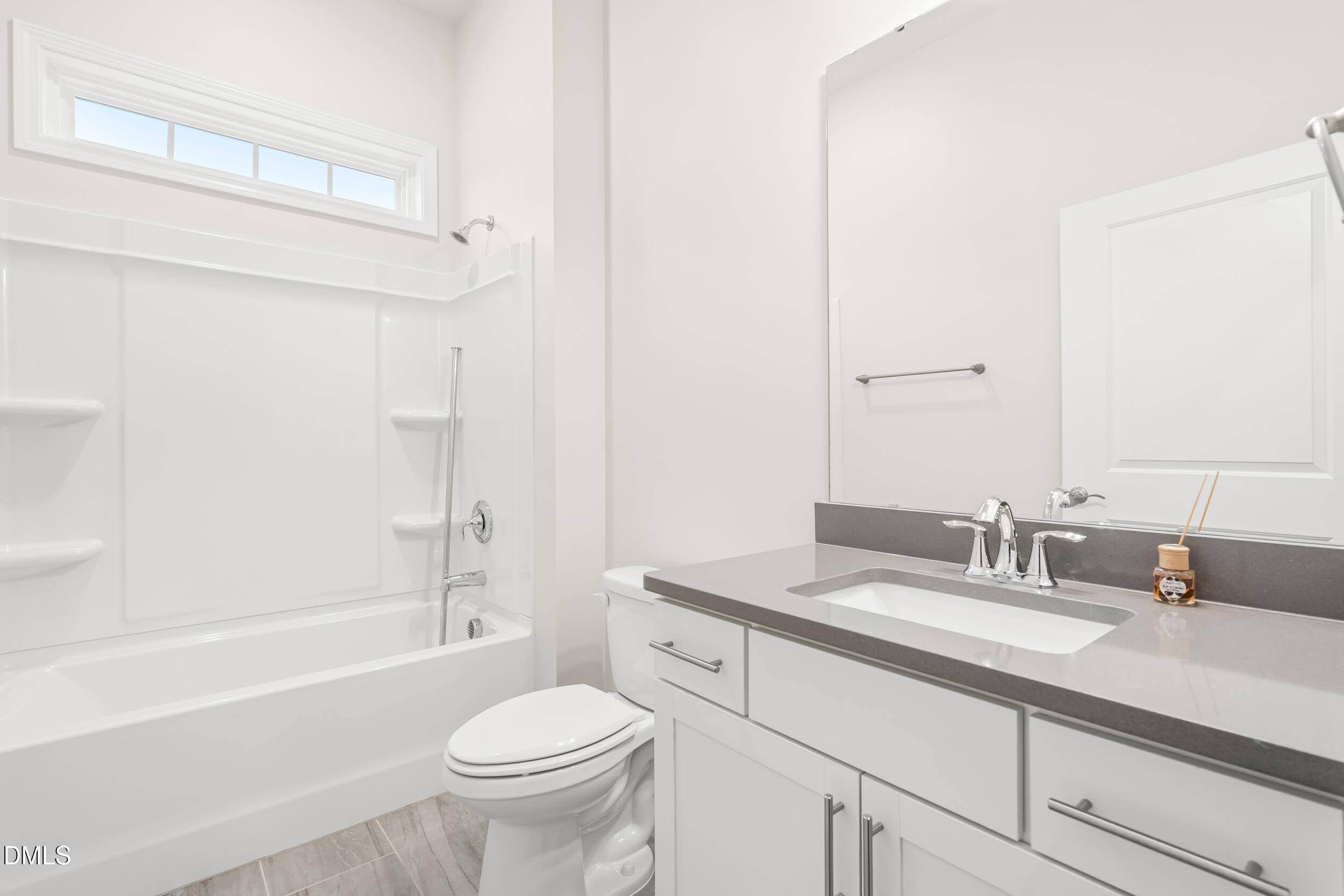 1 Bobby Parker Place Durham, NC 27703 - Photo 6 of 41 a bathroom with a sink a toilet and a bathtub