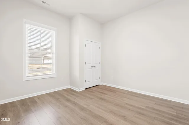 a view of a kitchen with a dishwasher cabinets and a large window