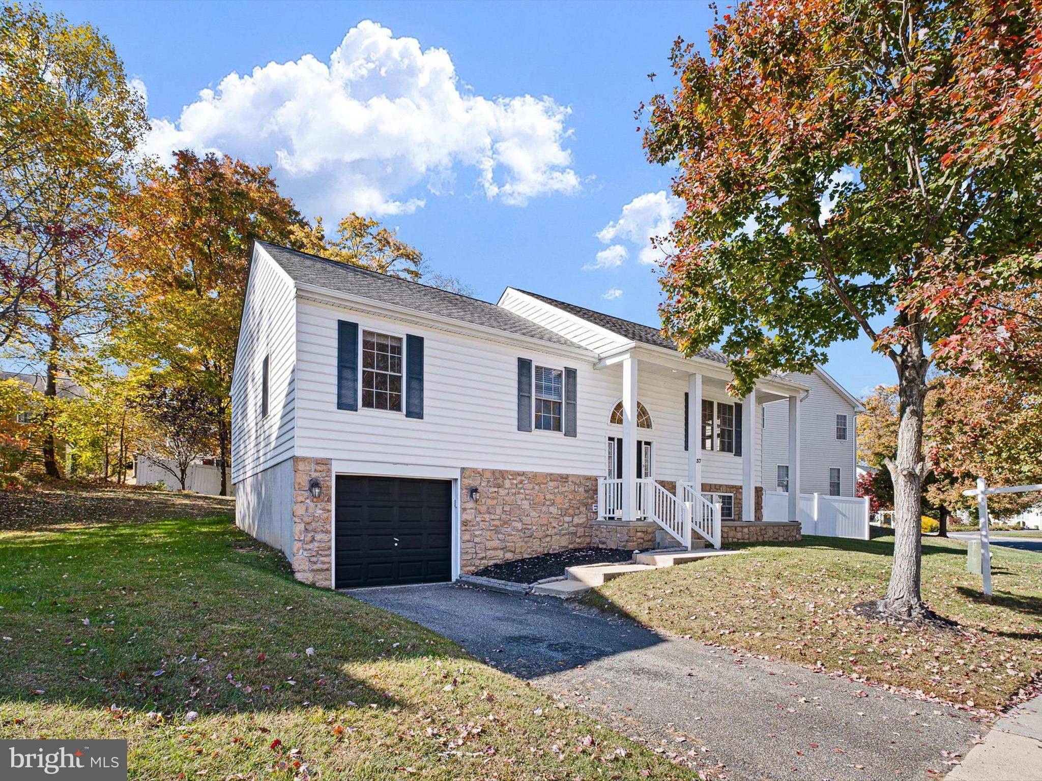 37 Jesse Boyd Circle Elkton, MD 21921 - Photo 2 of 29 a front view of a house with a garden