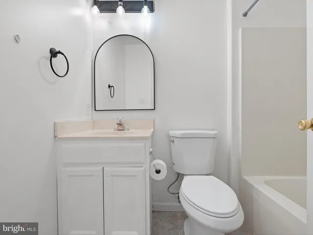 a bathroom with a sink a toilet and a bathtub