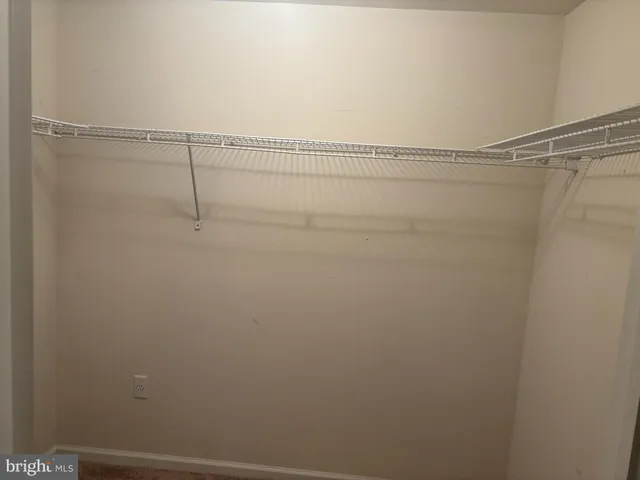 a bath room with a toilet and a bath tub