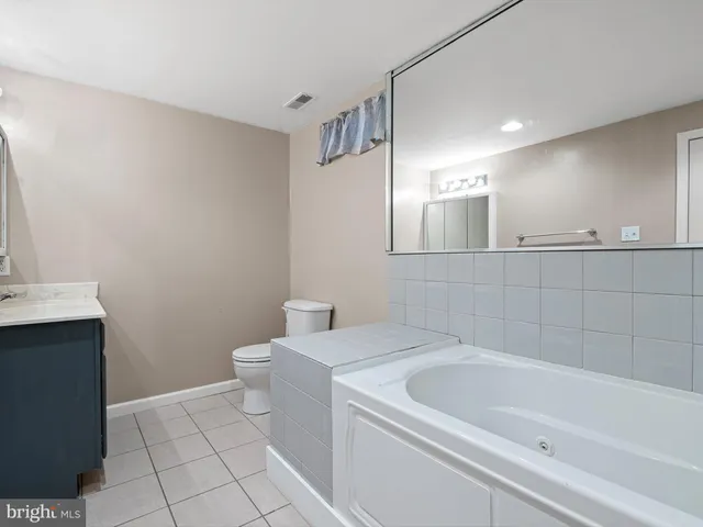 a living room with a couch and a counter top space