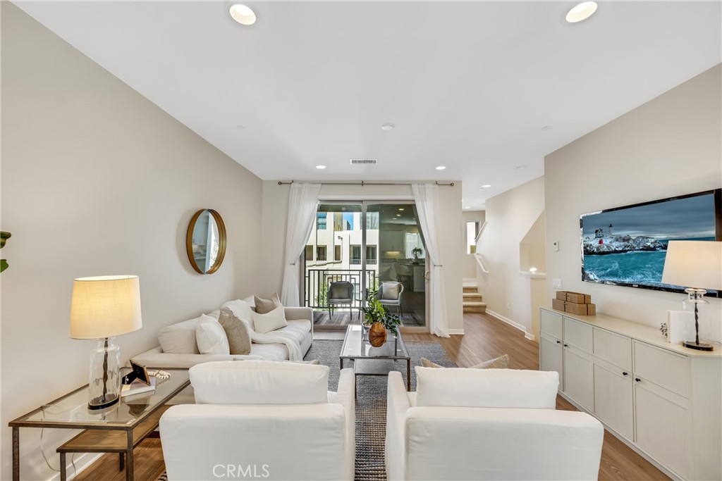 181 Magnet Irvine, CA 92618 - Photo 16 of 45 a living room with furniture a large window and a table