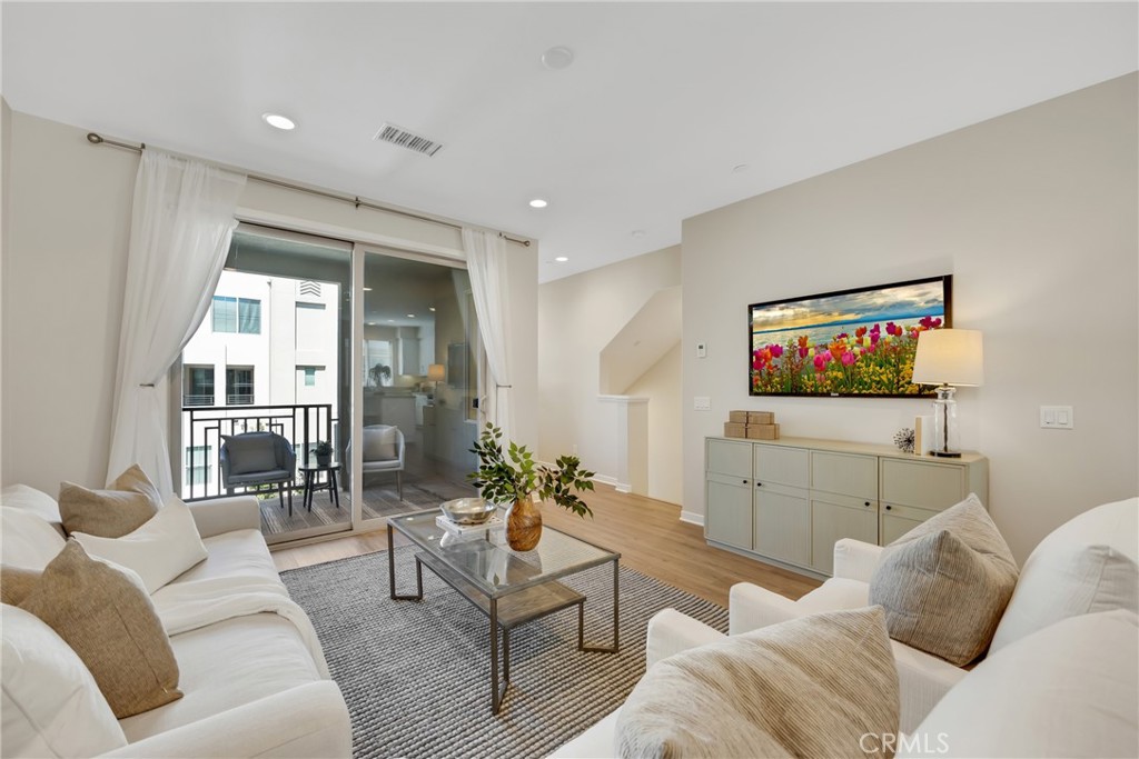 181 Magnet Irvine, CA 92618 - Photo 18 of 45 a living room with furniture and a flat screen tv