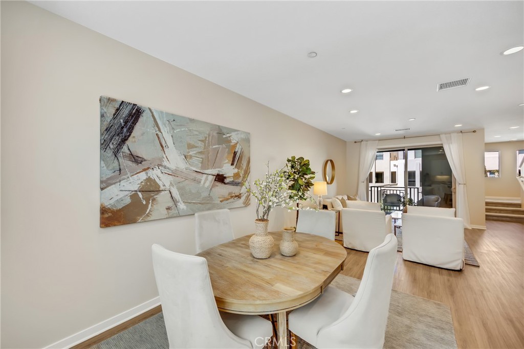 181 Magnet Irvine, CA 92618 - Photo 21 of 45 a view of a dining room with furniture and wooden floor