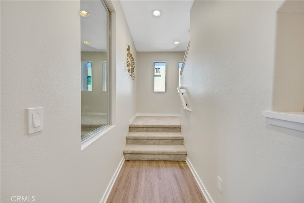 181 Magnet Irvine, CA 92618 - Photo 30 of 45 a view of entryway and hall with wooden floor