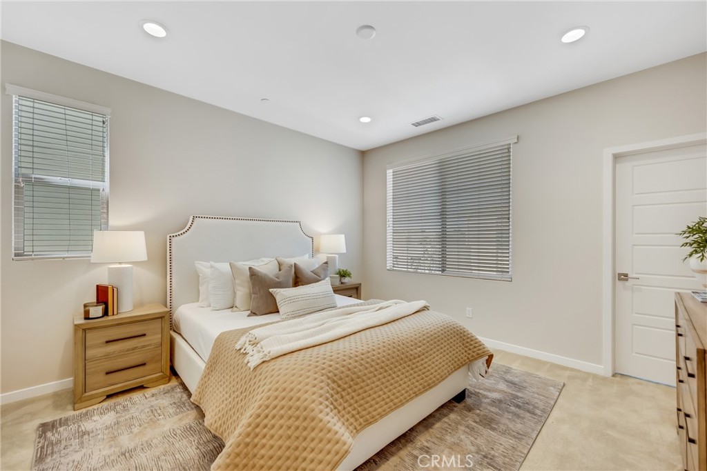181 Magnet Irvine, CA 92618 - Photo 32 of 45 a bedroom with a bed and a window