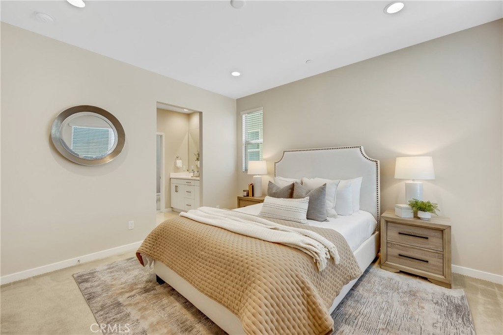 181 Magnet Irvine, CA 92618 - Photo 33 of 45 a bedroom with a bed and a chandelier