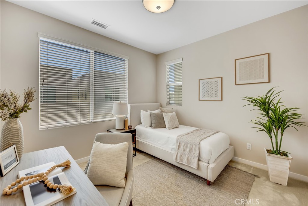 181 Magnet Irvine, CA 92618 - Photo 39 of 45 a bedroom with a bed and a window