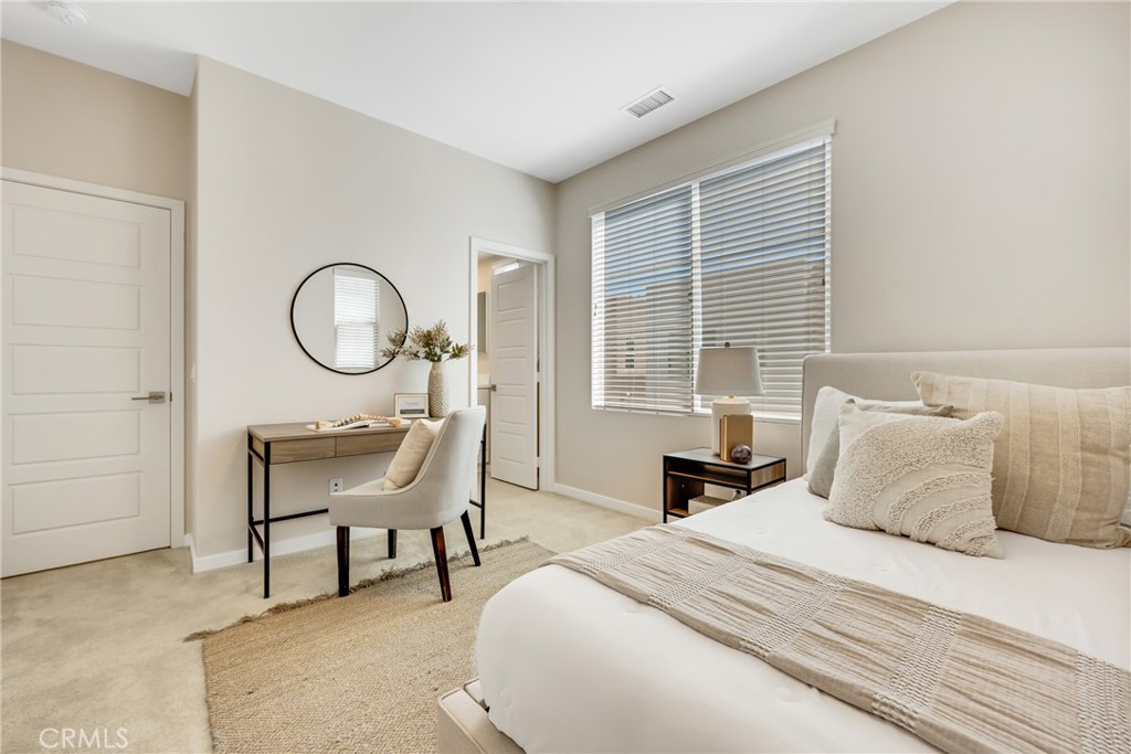 181 Magnet Irvine, CA 92618 - Photo 40 of 45 a bed room with a bed a chair and a window