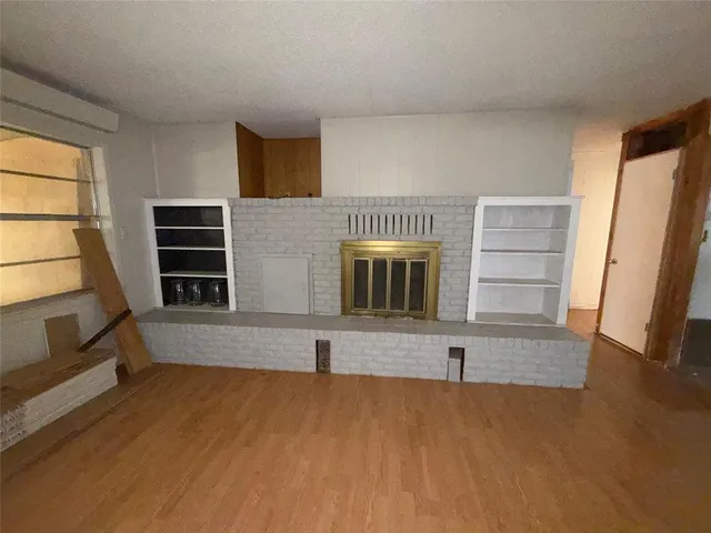 a living room with closet and flat screen tv