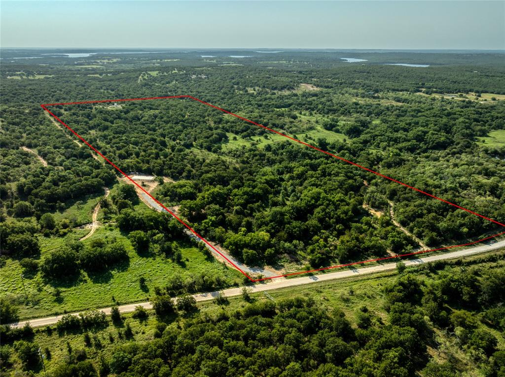 2913 County Line Road Chico, TX 76431 - Photo 12 of 18 an aerial view of residential houses with outdoor space and trees