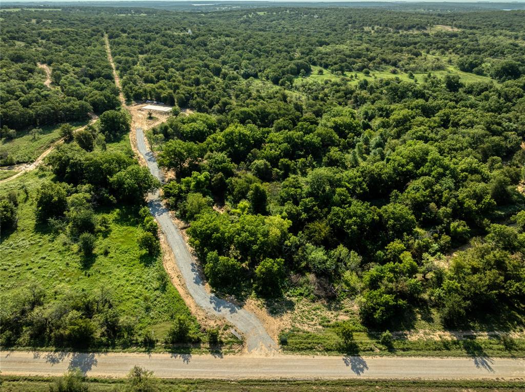 2913 County Line Road Chico, TX 76431 - Photo 6 of 18 an aerial view of residential houses with outdoor space and trees