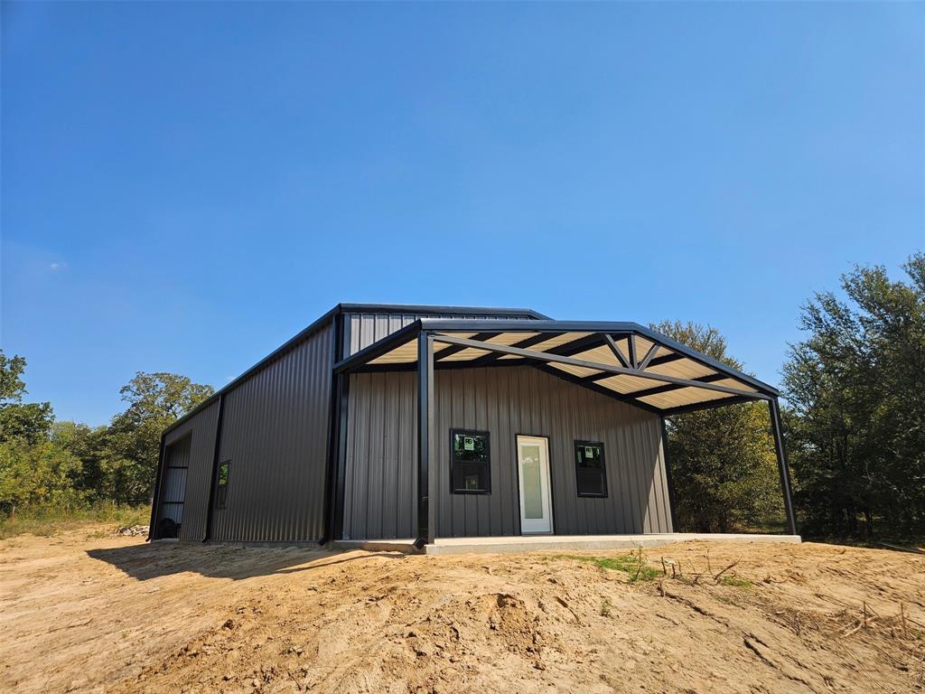2913 County Line Road Chico, TX 76431 - Photo 7 of 18 a front view of a house with a yard