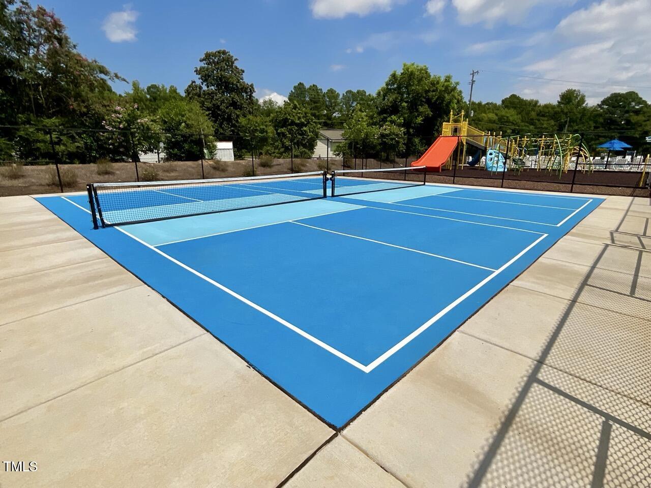 166 Nimble Way Clayton, NC 27520 - Photo 33 of 40 a view of tennis court with houses
