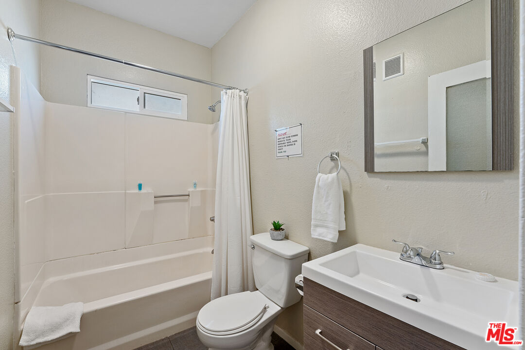 330 Cedar Avenue Long Beach, CA 90802 - Photo 12 of 18 a bathroom with a sink a toilet and shower