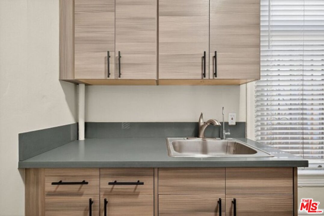 330 Cedar Avenue Long Beach, CA 90802 - Photo 14 of 18 a kitchen with a sink and cabinets