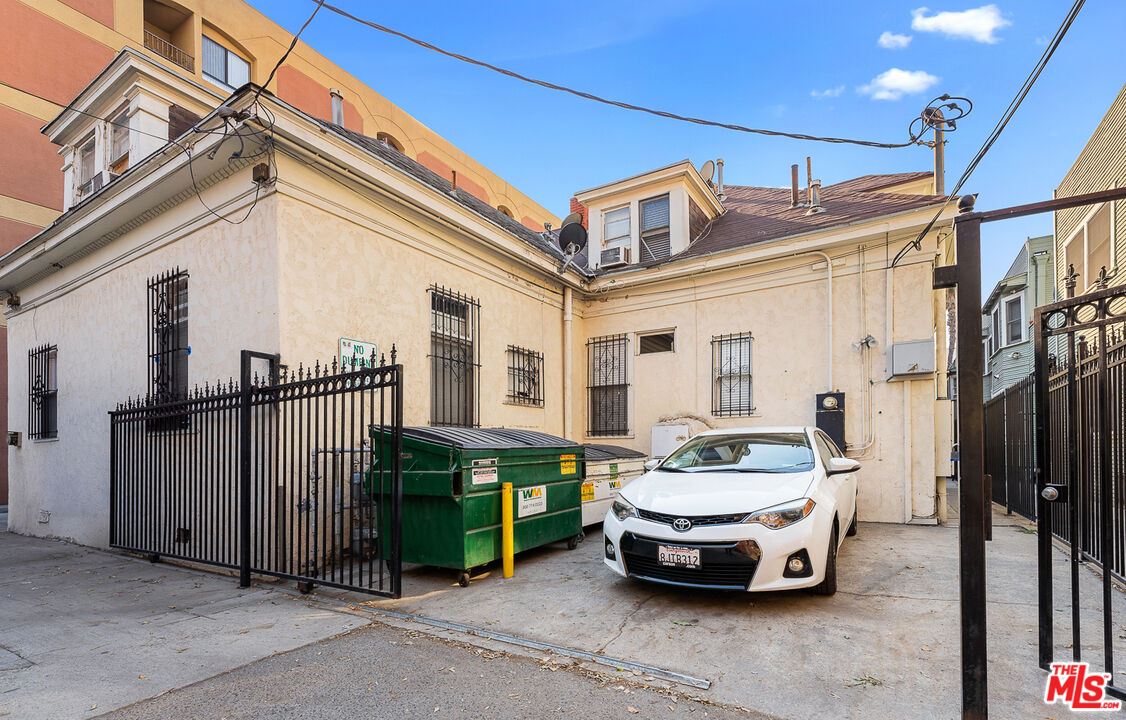 330 Cedar Avenue Long Beach, CA 90802 - Photo 4 of 18 a car parked in front of a white building