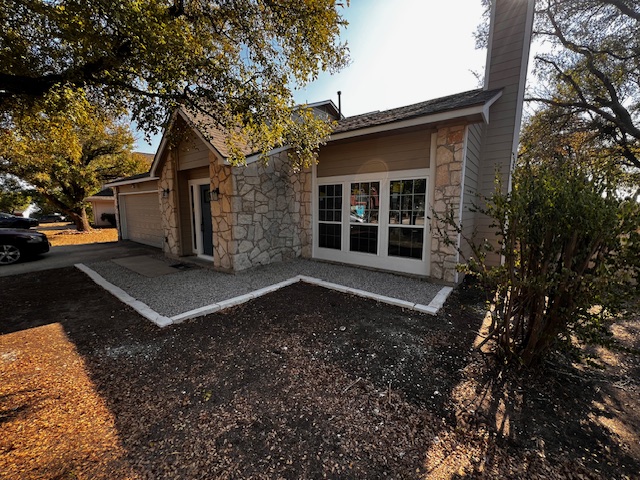 13236 Kerrville Folkway Austin, TX 78729 - Photo 1 of 16 a front view of a house with a yard