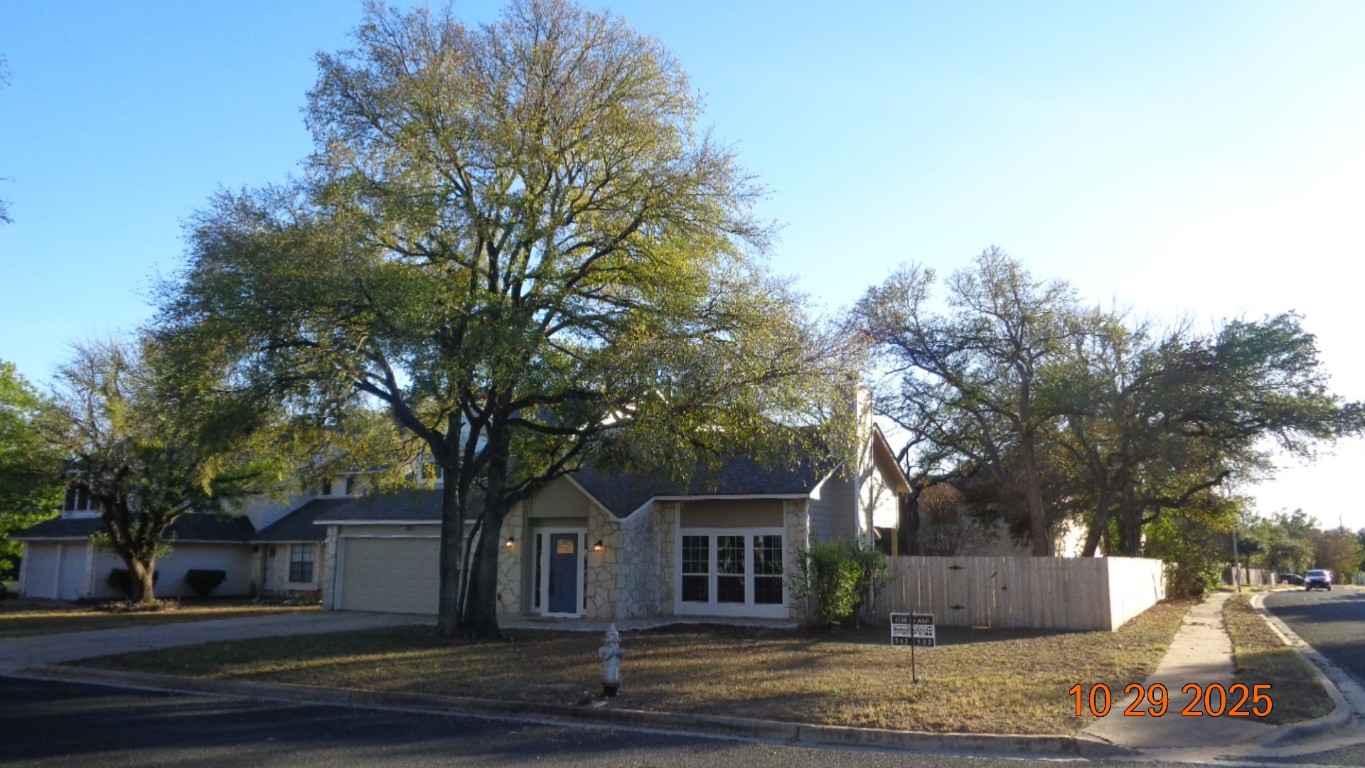 13236 Kerrville Folkway Austin, TX 78729 - Photo 11 of 16 front view of house with a yard