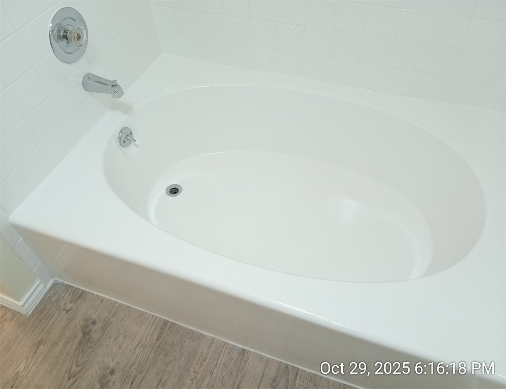 13236 Kerrville Folkway Austin, TX 78729 - Photo 15 of 16 a bath tub sitting next to a shower